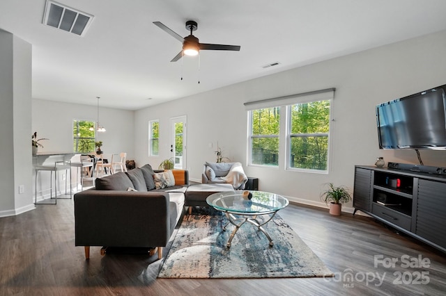 11040 E Lake Rd, Charlotte, NC 28215 - living area with wood finished floors, ceiling fan, and visible vents
