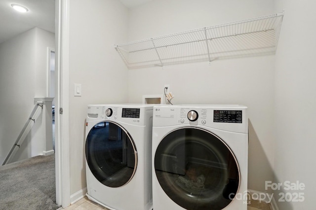 11040 E Lake Rd, Charlotte, NC 28215 - clothes washing area with washer and clothes dryer, light carpet, laundry area, and baseboards