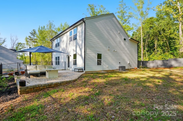 11040 E Lake Rd, Charlotte, NC 28215 - back of house featuring a patio area, fence, a yard, and central air condition unit