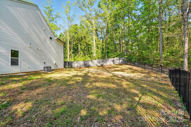 11040 E Lake Rd, Charlotte, NC 28215 - view of yard featuring central AC unit and a fenced backyard