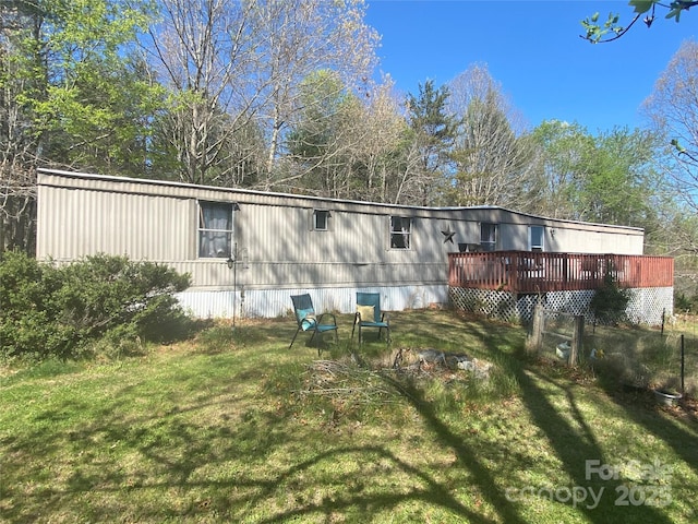 1798 Lonnie Shuffler St, Morganton, NC 28655 - rear view of house featuring a wooden deck and a lawn