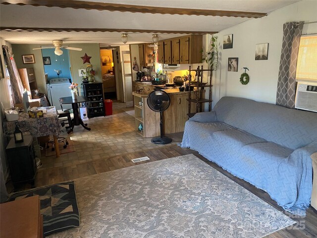 1798 Lonnie Shuffler St, Morganton, NC 28655 - living room with dark wood-type flooring, ceiling fan, and washer / dryer