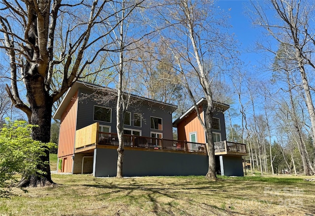 8061 State Highway 80 S, Burnsville, NC 28714 - back of property with a deck and a lawn