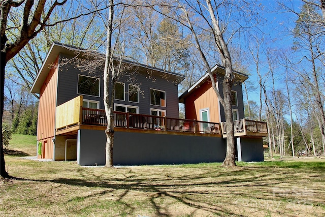 8061 State Highway 80 S, Burnsville, NC 28714 - rear view of house featuring a deck and a lawn