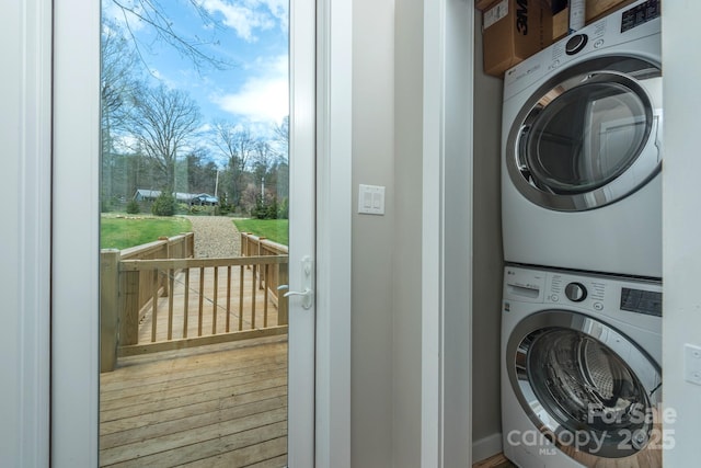 8061 State Highway 80 S, Burnsville, NC 28714 - laundry area with stacked washer and clothes dryer, wood finished floors, and laundry area