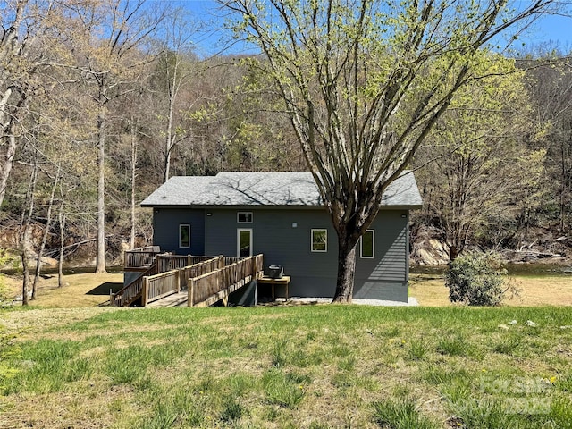 8061 State Highway 80 S, Burnsville, NC 28714 - rear view of house featuring a yard, a wooden deck, and a wooded view