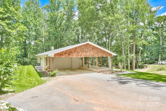 125 Dutchman Creek Rd, Elkin, NC 28621 - view of car parking featuring asphalt driveway and a carport