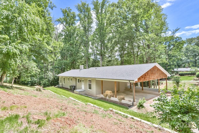 125 Dutchman Creek Rd, Elkin, NC 28621 - rear view of house with a chimney and driveway