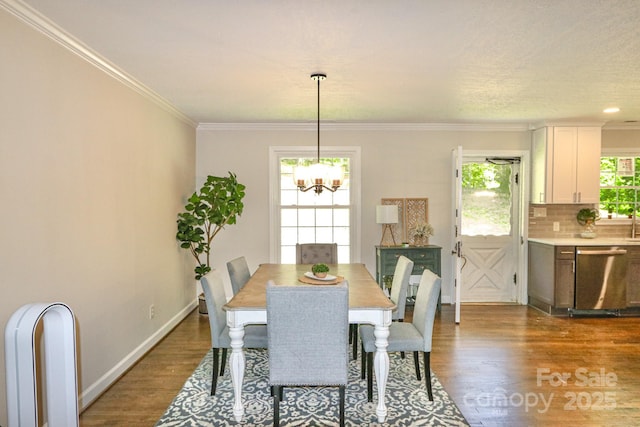 125 Dutchman Creek Rd, Elkin, NC 28621 - dining area featuring dark wood-style floors, a chandelier, ornamental molding, and baseboards