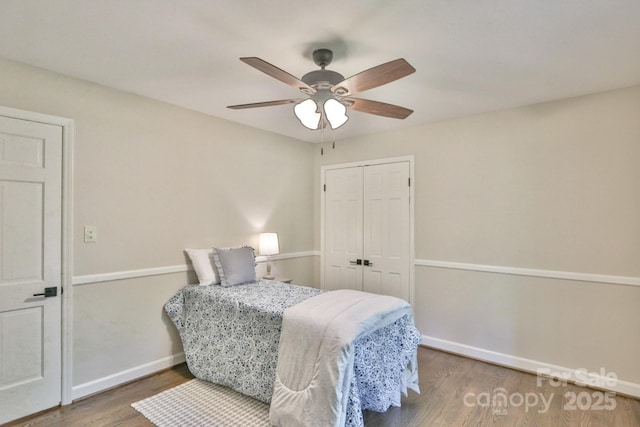 125 Dutchman Creek Rd, Elkin, NC 28621 - bedroom featuring wood finished floors, baseboards, a closet, and a ceiling fan