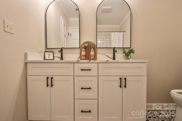 125 Dutchman Creek Rd, Elkin, NC 28621 - full bathroom featuring crown molding, toilet, double vanity, and baseboards