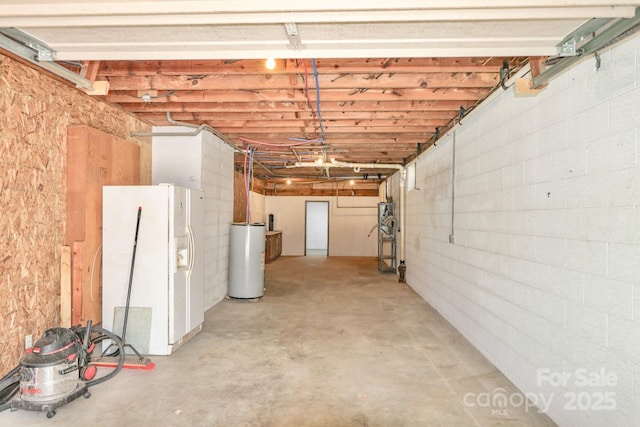 125 Dutchman Creek Rd, Elkin, NC 28621 - basement featuring white fridge with ice dispenser, water heater, and a garage