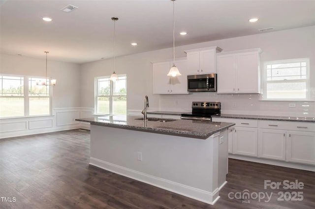 184 Swann Rd Unit 1, Statesville, NC 28625 - kitchen with stainless steel appliances, visible vents, white cabinetry, and a sink