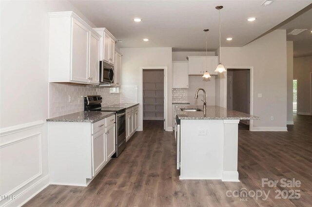 184 Swann Rd Unit 1, Statesville, NC 28625 - kitchen featuring tasteful backsplash, a sink, light stone counters, and appliances with stainless steel finishes