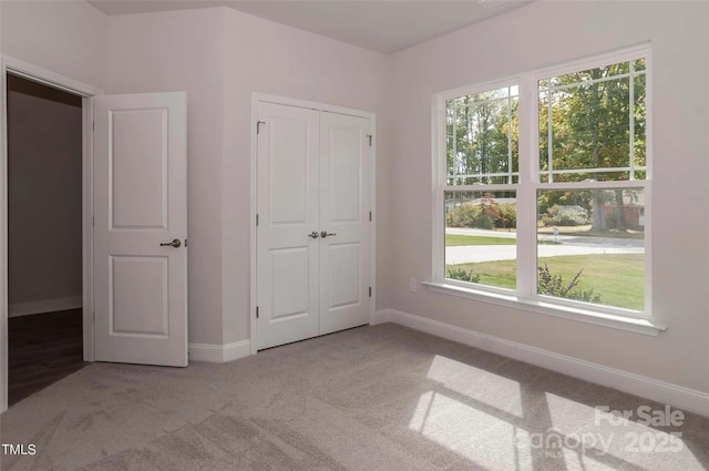184 Swann Rd Unit 1, Statesville, NC 28625 - unfurnished bedroom featuring a closet, baseboards, and carpet floors