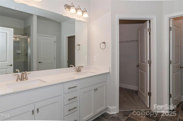 184 Swann Rd Unit 1, Statesville, NC 28625 - bathroom featuring a shower stall, double vanity, visible vents, and a sink
