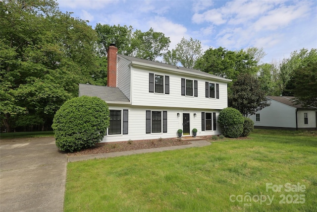 2413 Bergen Ct, Charlotte, NC 28210 - colonial-style house with a front yard and a chimney