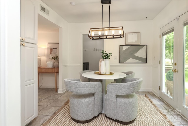 2413 Bergen Ct, Charlotte, NC 28210 - dining space featuring baseboards, visible vents, and light tile patterned floors