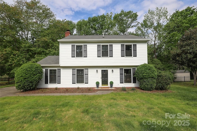 2413 Bergen Ct, Charlotte, NC 28210 - colonial home with fence, a chimney, and a front yard