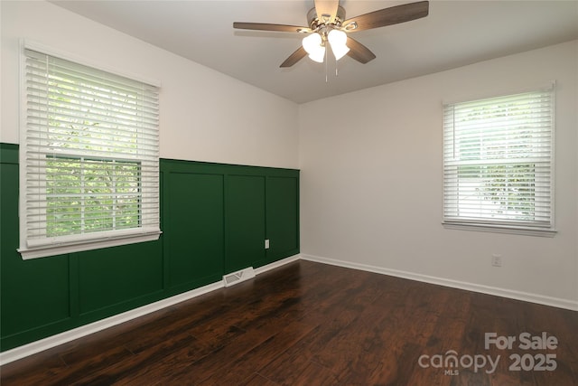 2413 Bergen Ct, Charlotte, NC 28210 - spare room with visible vents, ceiling fan, and dark wood finished floors