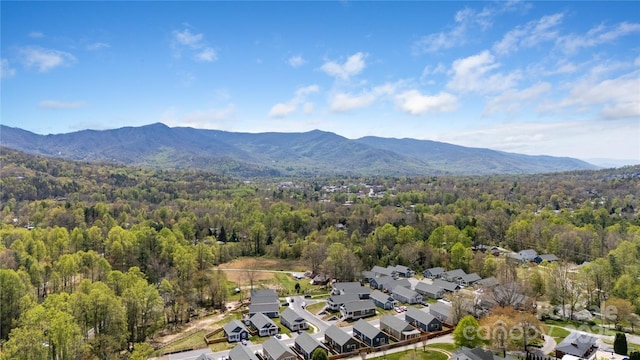 bird's eye view with a residential view, a view of trees, and a mountain view