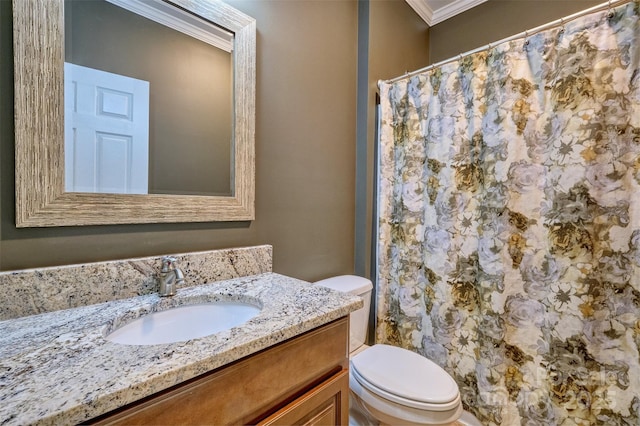 bathroom featuring a shower with shower curtain, vanity, ornamental molding, and toilet