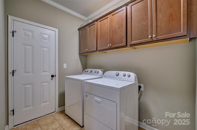 laundry room with separate washer and dryer, baseboards, ornamental molding, light tile patterned flooring, and cabinet space