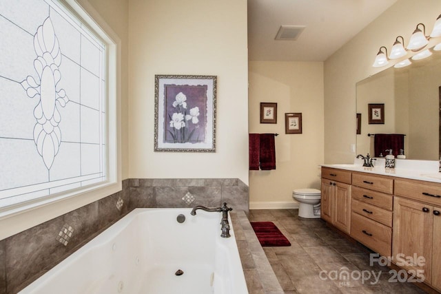 full bathroom with double vanity, visible vents, toilet, and a jetted tub