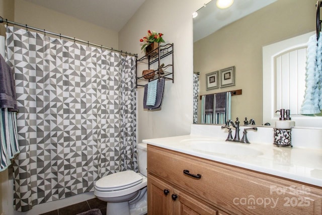 full bathroom with tile patterned floors, vanity, toilet, and curtained shower