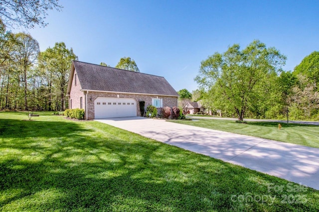 view of front of house with concrete driveway, a front yard, brick siding, and a garage
