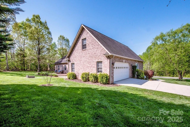 view of side of home with concrete driveway, roof with shingles, an attached garage, a yard, and brick siding