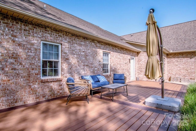 wooden deck featuring an outdoor hangout area