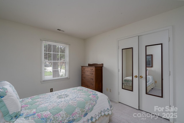 6815 Old Post Rd, Charlotte, NC 28212 - bedroom featuring light carpet, visible vents, a closet, and french doors