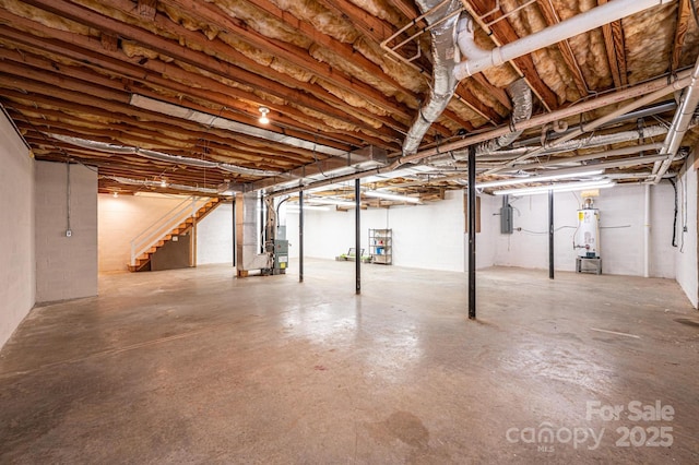 unfinished below grade area with water heater, stairway, heating unit, and electric panel