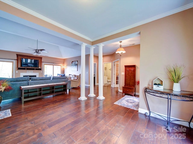 135 Boulder Ridge Dr, Denton, NC 27239 - living area featuring crown molding, ceiling fan, dark wood finished floors, ornate columns, and baseboards