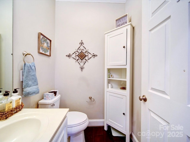 135 Boulder Ridge Dr, Denton, NC 27239 - half bath featuring vanity, baseboards, toilet, and wood finished floors