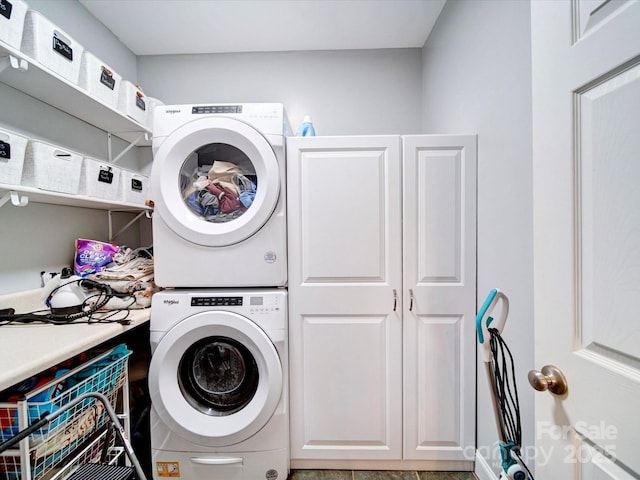 135 Boulder Ridge Dr, Denton, NC 27239 - laundry room with stacked washer / dryer and cabinet space