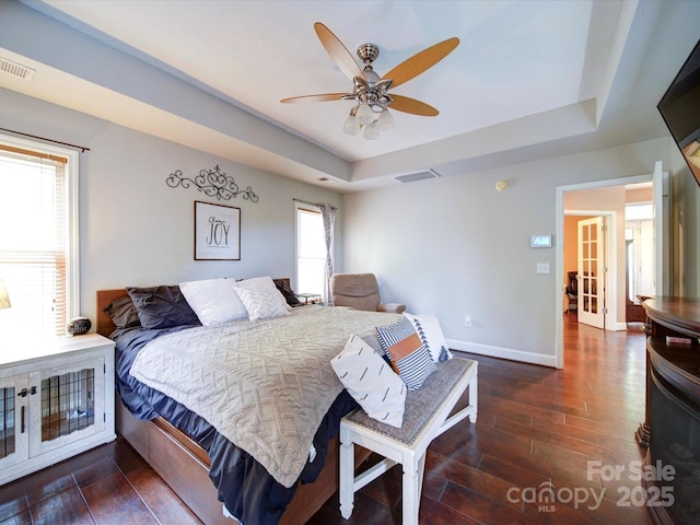 135 Boulder Ridge Dr, Denton, NC 27239 - bedroom featuring visible vents, a tray ceiling, and wood finished floors
