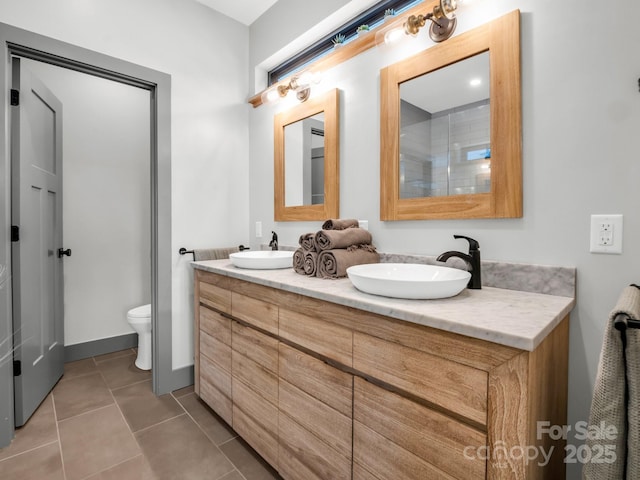 408 S Oconeechee Ave, Black Mountain, NC 28711 - bathroom with double vanity, a sink, tile patterned flooring, and toilet