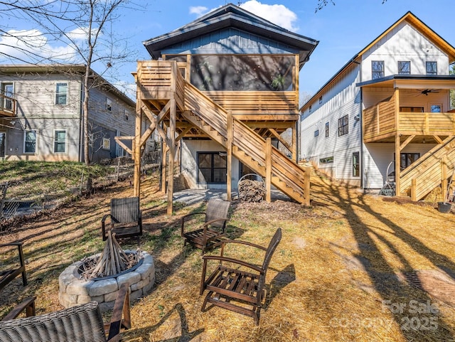 408 S Oconeechee Ave, Black Mountain, NC 28711 - back of property with ceiling fan, a fire pit, fence, and stairway