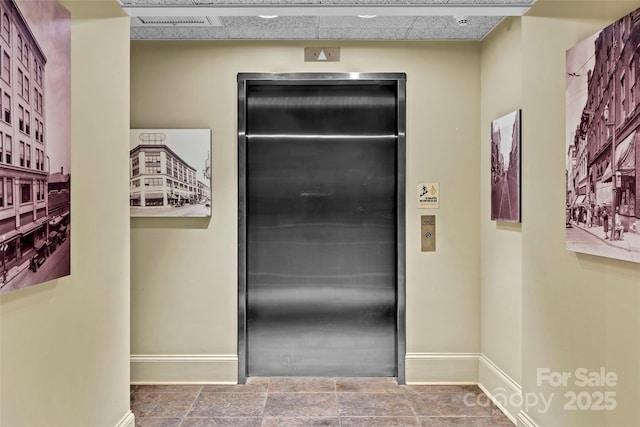 84 Walnut St Unit 203, Asheville, NC 28801 - bathroom with baseboards, elevator, and visible vents
