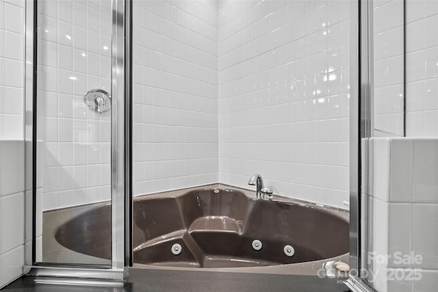 84 Walnut St Unit 203, Asheville, NC 28801 - bathroom featuring a jetted tub and a stall shower