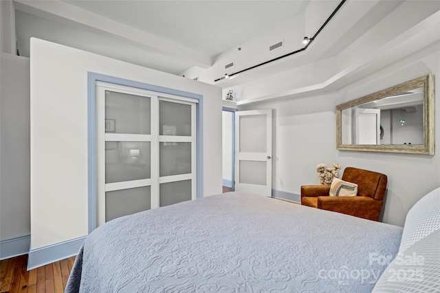 84 Walnut St Unit 203, Asheville, NC 28801 - bedroom featuring wood finished floors and visible vents