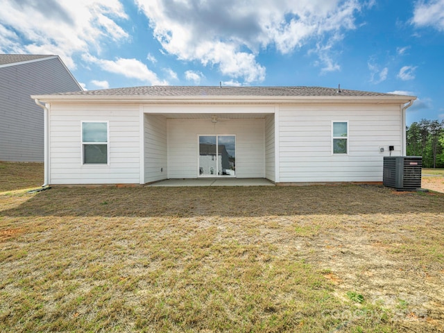 back of house featuring a patio, central air condition unit, and a yard