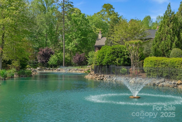 view of water feature featuring fence