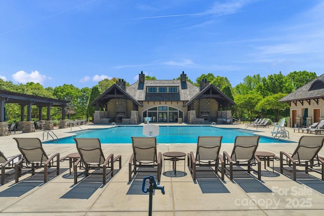 community pool featuring a patio area