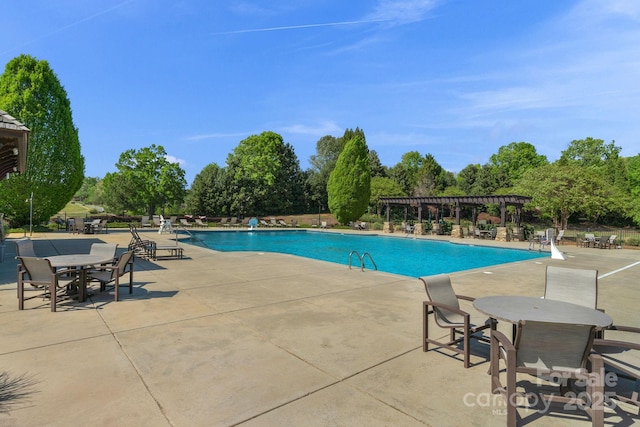 community pool featuring a patio and a pergola