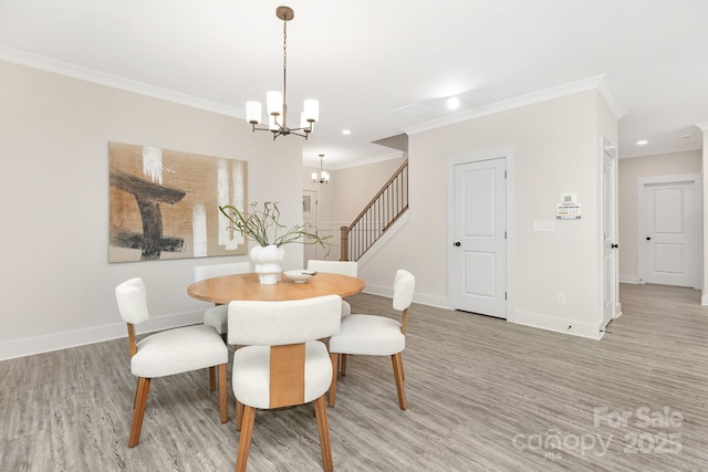 dining space featuring crown molding, stairway, baseboards, an inviting chandelier, and light wood-style flooring