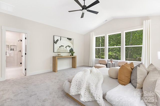 carpeted bedroom with baseboards, visible vents, connected bathroom, and lofted ceiling
