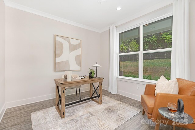 office area featuring baseboards, ornamental molding, recessed lighting, and wood finished floors